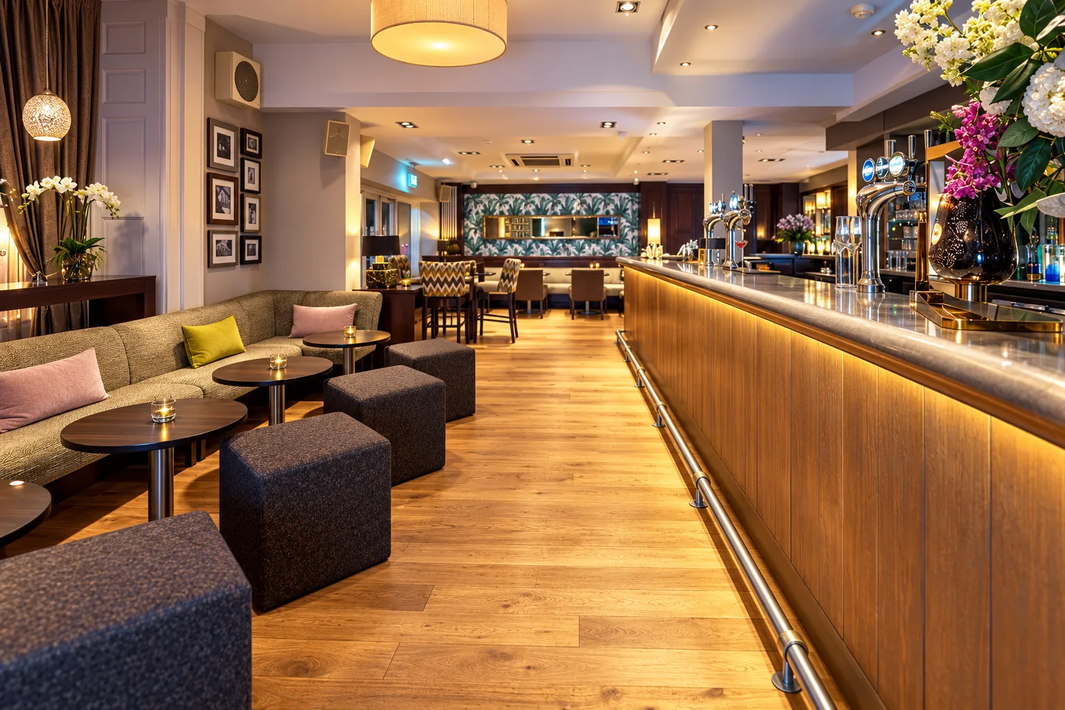 AI interior illustration based on Mandolay Hotel’s official lounge-bar photograph: its long illuminated timber bar, pale stone counter, curved banquette, timber floor, framed artwork, flowers and botanical feature wall. Not an actual photograph of the premises, staff or guests.